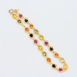 A delicate 18ct yellow gold bracelet set with pear shaped multi-coloured sapphires, total sapphire