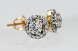 A pair of 18ct yellow gold diamond cluster studs with screw backs.