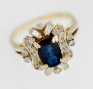 An 18ct sapphire and diamond cluster ring, set with a central sapphire