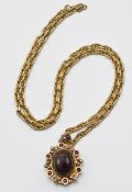 A rare and stunning garnet and amethyst memorial pendant with heavy gage chain, marked 750