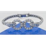 A fine art deco platinum and diamond set bracelet, length including open catch 16cm (approx. 14 cm