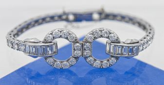 A fine art deco platinum and diamond set bracelet, length including open catch 16cm (approx. 14 cm