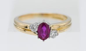 An 18ct yellow gold diamond and ruby ring, size L.