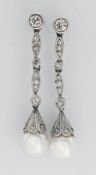 A fine pair of stylish pearl and diamond drop earrings, set with diamonds, 18ct gold clasp, length