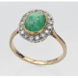 An 18ct yellow emerald and diamond cluster ring, size O.