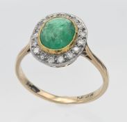 An 18ct yellow emerald and diamond cluster ring, size O.
