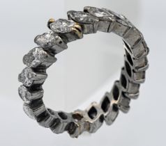 A fine diamond full band eternity ring, the pear cut diamonds weighing approx. 4 carats, set in