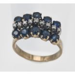 A 9ct yellow gold sapphire and diamond cluster ring, size N/O (hallmark rubbed).