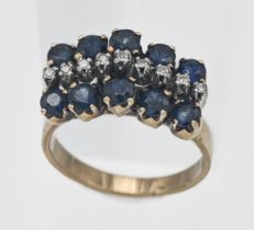 A 9ct yellow gold sapphire and diamond cluster ring, size N/O (hallmark rubbed).