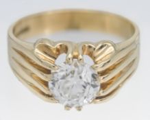An 18ct yellow gold and diamond solitaire engagement ring, the claw set old brilliant cut diamond
