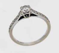 An 18ct white gold diamond single stone ring, size M.