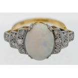 An 18ct large opal and diamond shoulder stepped ring, size M.