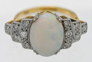 An 18ct large opal and diamond shoulder stepped ring, size M.