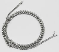 A fine 18ct white gold and diamond set fancy necklace / choker, set with a combination of pear and
