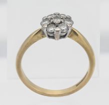 An 18ct yellow gold and diamond set cluster ring, size O.