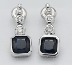 A pair of 18k white gold diamond and sapphire drop earrings, marked on both K18 0.175.