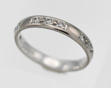 An 18ct white gold diamond set band ring.