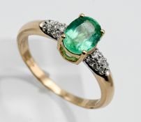 An 18ct yellow gold emerald and diamond ring, size Q.