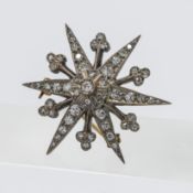 Antique diamond set star brooch, diameter 37mm.