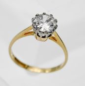 An 18ct yellow gold diamond solitaire ring, claw set, the modern brilliant cut stone weighing 1.20