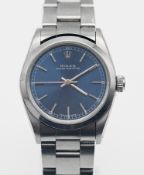 Rolex, a mid size Oyster Perpetual stainless steel automatic wristwatch, blue dial, model 67480/