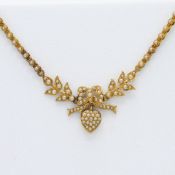 A yellow gold (probably 18ct) seed pearl lover's knot necklace, the centre knot with leaf pattern