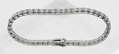 A fine 18ct white gold diamond line bracelet set with forty five modern brilliant cut diamonds,