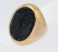 A yellow gold heavy gauge onyx set signet ring, approx. 12.65g.