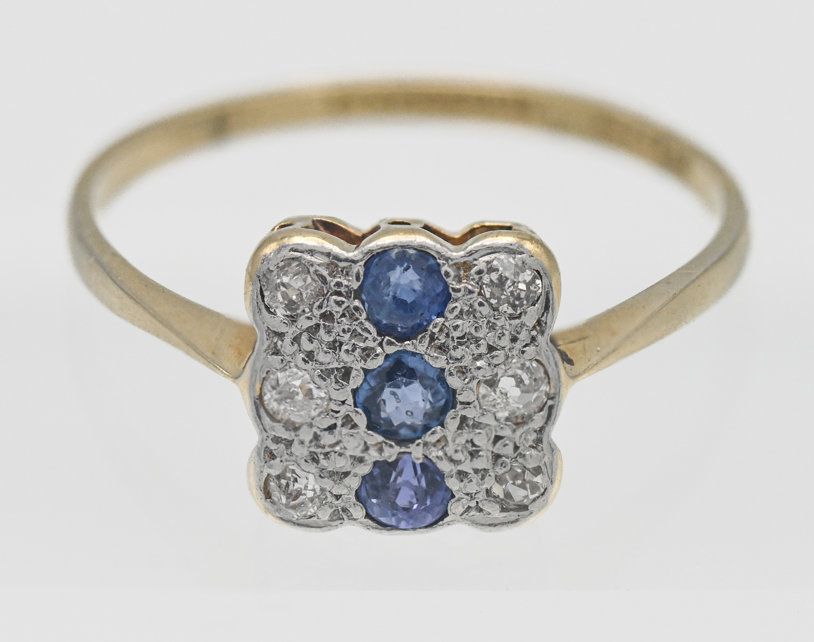 An 18ct diamond and sapphire set square shape ring, size V.