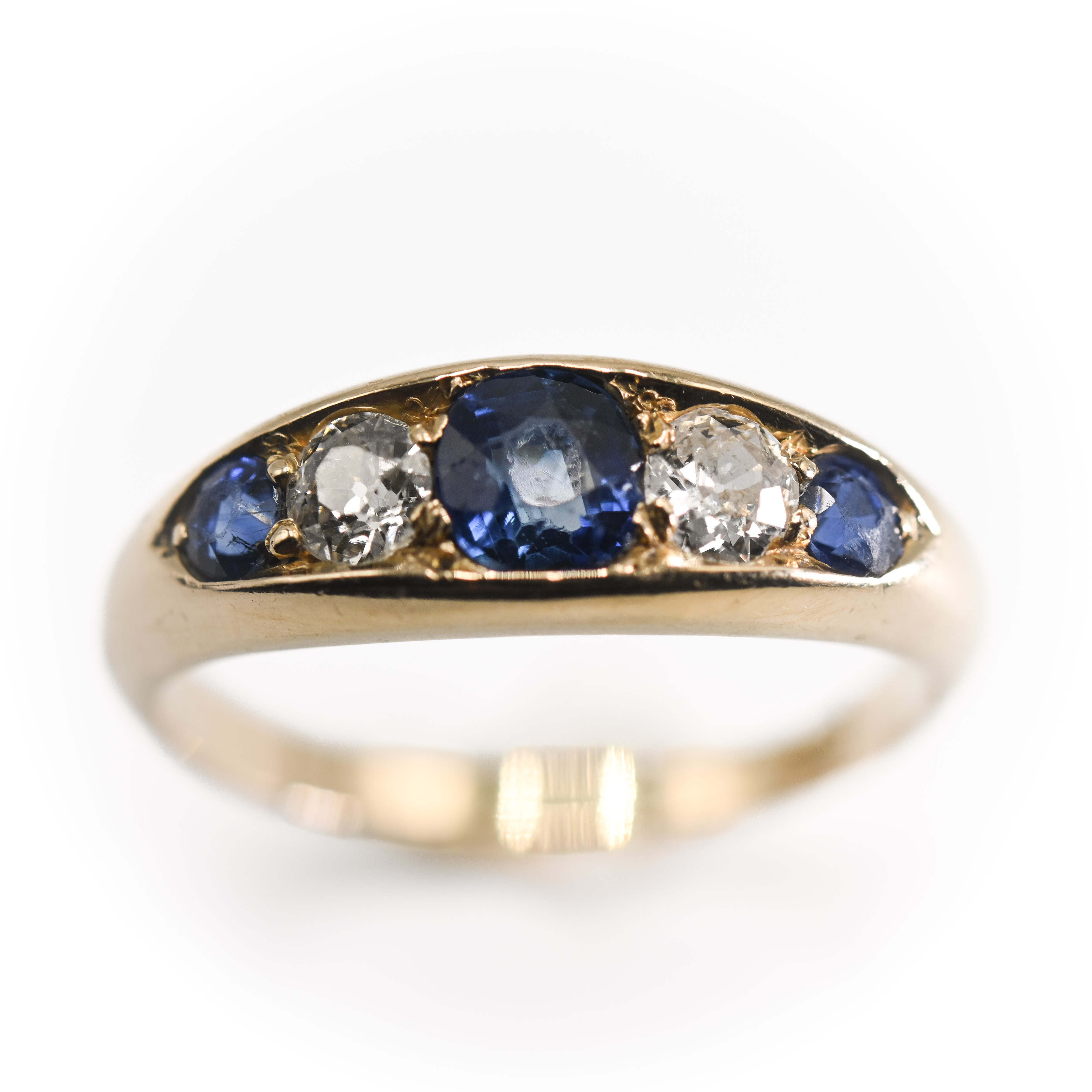 An antique 18ct yellow gold five stone ring set with three sapphires & two diamonds, the central - Image 2 of 2