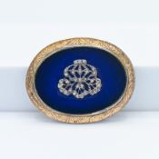 A 19th century oval plaque style yellow metal gold brooch, oval blue glass set with diamond