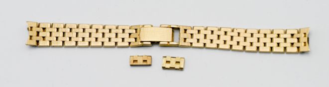 An 18ct yellow gold watch bracelet, with two small links, weight 35.90 grammes