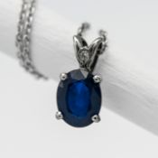 A platinum and sapphire set pendant, the oval cut platinum 1.85carats, further set with a single