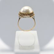 A Mabe pearl single stone ring, clawed edge settings, stamped 9ct, size N, total weight approx. 5.