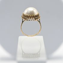 A Mabe pearl single stone ring, clawed edge settings, stamped 9ct, size N, total weight approx. 5.