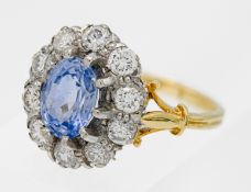 A 18ct yellow gold diamond and sapphire cluster ring, size O.