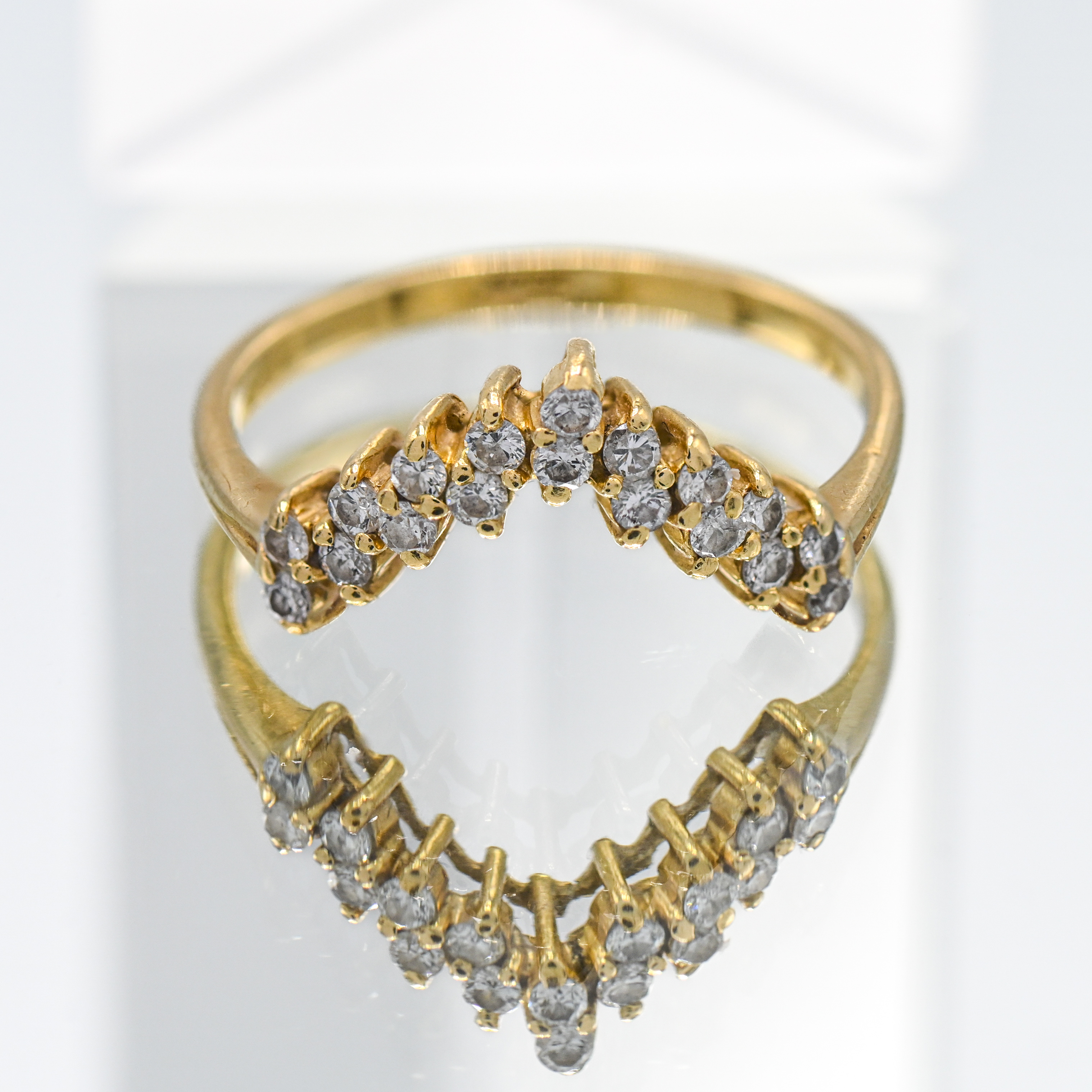 An 18ct yellow gold diamond set wishbone ring, size U, total weight approx. 4.0g.