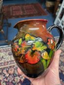 William Moorcroft, flambe orchid jug. height 16cm.