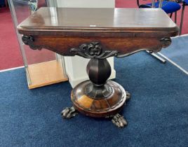 A Victorian rosewood fold over pedestal card table on claw feet, width 91cm.