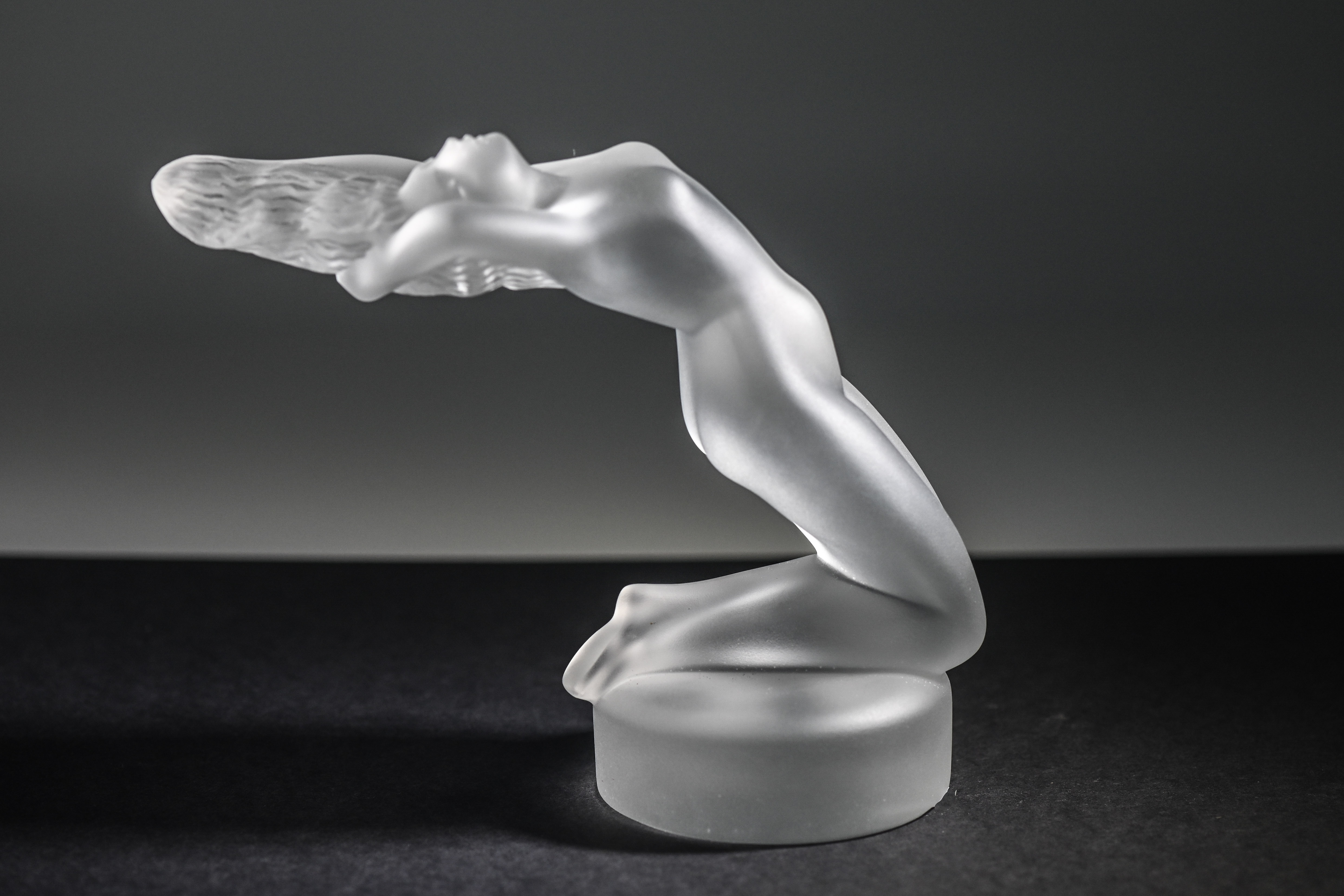 A frosted glass mascot style figure of nude lady, signed 'Lalique France', height 13cm