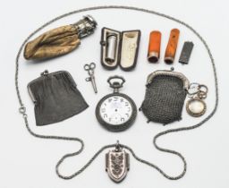 Antique silver cased locket, pocket watch, gold mounted and amber cigarette holder, silver holder,