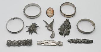 A small collection of silver jewellery to include silver bangles, marcasite jewellery and brooch