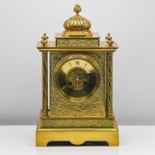 A French ornate all brass mantle clock with gong strike, height 44cm.