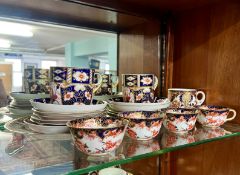 A quantity of Royal Crown Derby cups, saucers and plates.