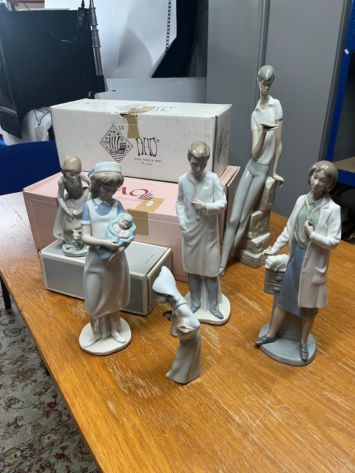 Collection of six Lladro and Nao figures including The Book Reader' height 46cm, etc (6), some