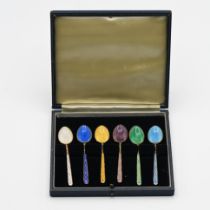 A cased set of six silver and coloured enamelled tea spoons.