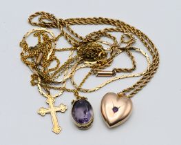 A mixed collection of necklaces / chains to include a heart shaped locket.