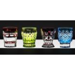 A velvet cased set of four Faberge coloured crystal vodka shot glasses.