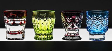 A velvet cased set of four Faberge coloured crystal vodka shot glasses.