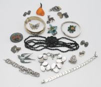 A mixed lot to include brooches, silver cufflinks etc.